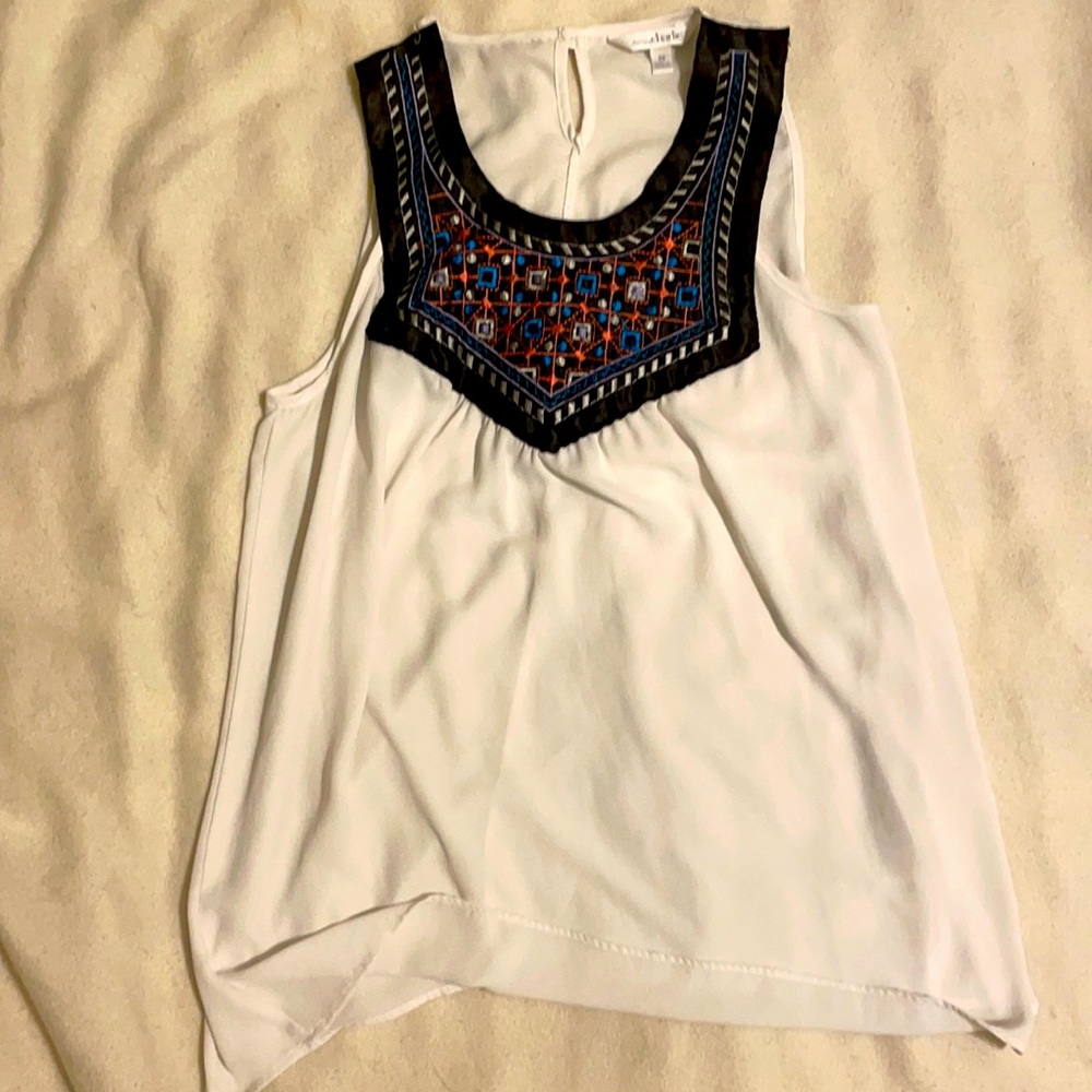 White sleeveless blouse